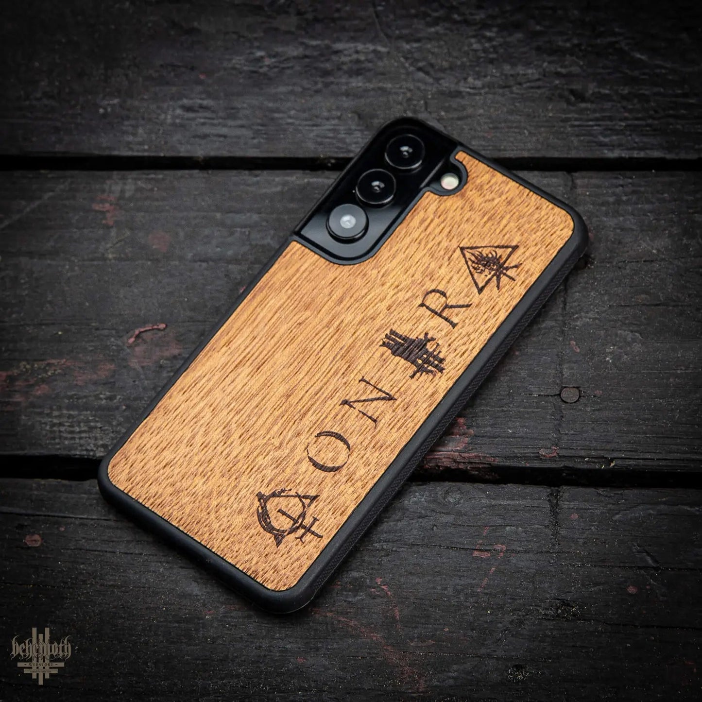 Samsung Galaxy S22 case with wood finishing and Behemoth 'CONTRA' logo